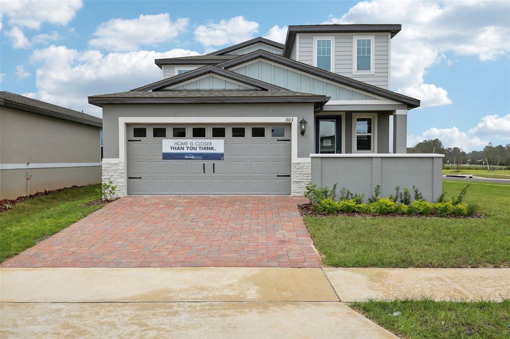 front view of a house with a yard