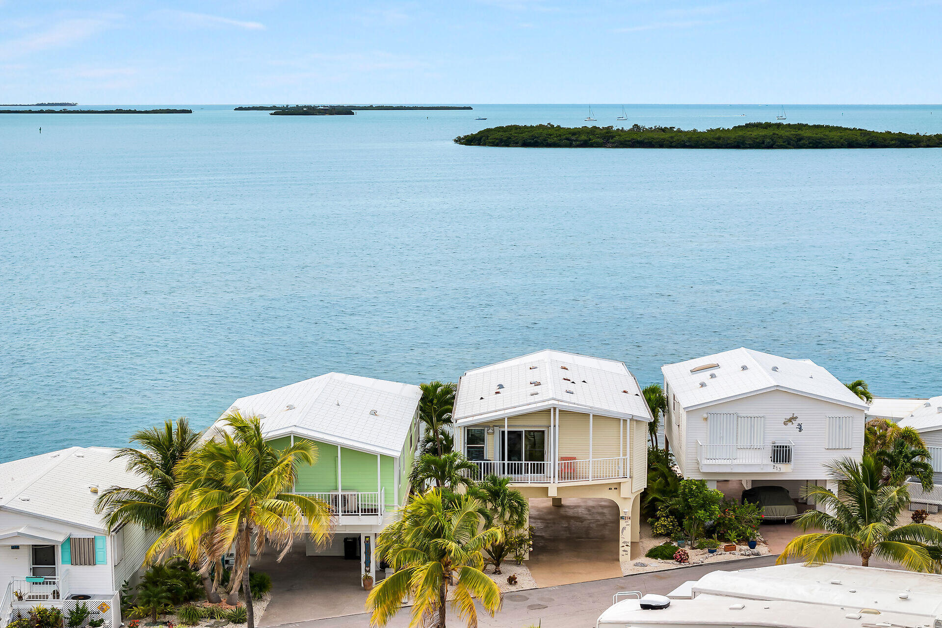 an aerial view of a house with outdoor space and lake view