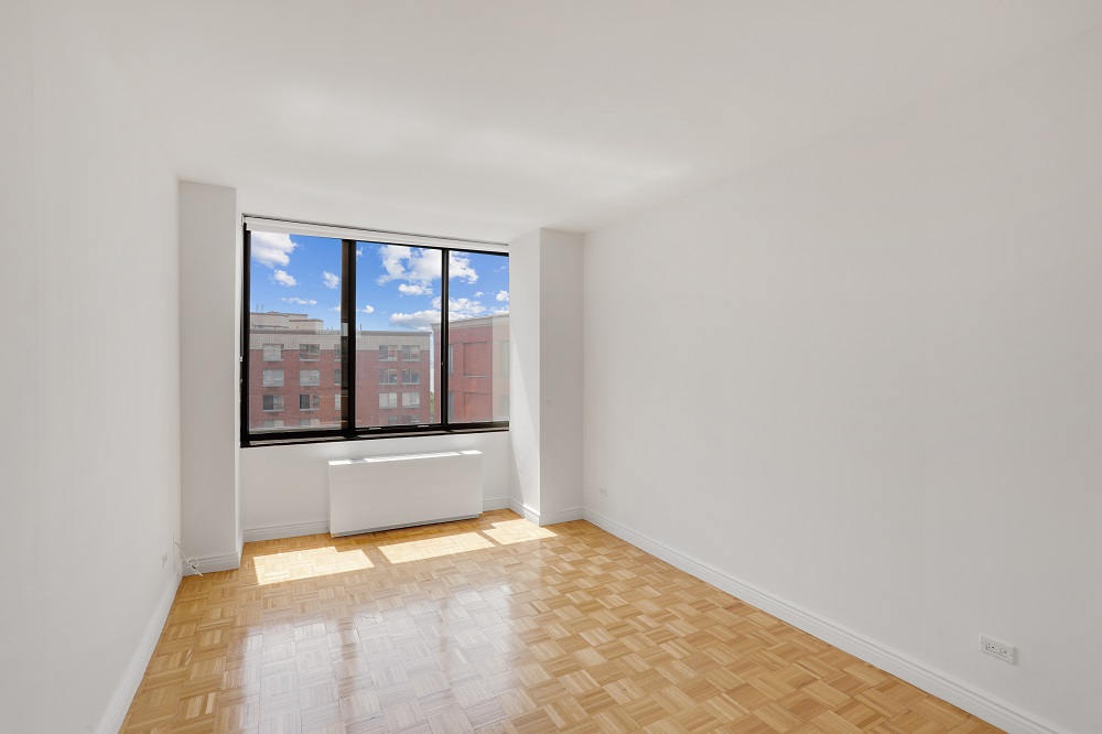 a view of an empty room with a window