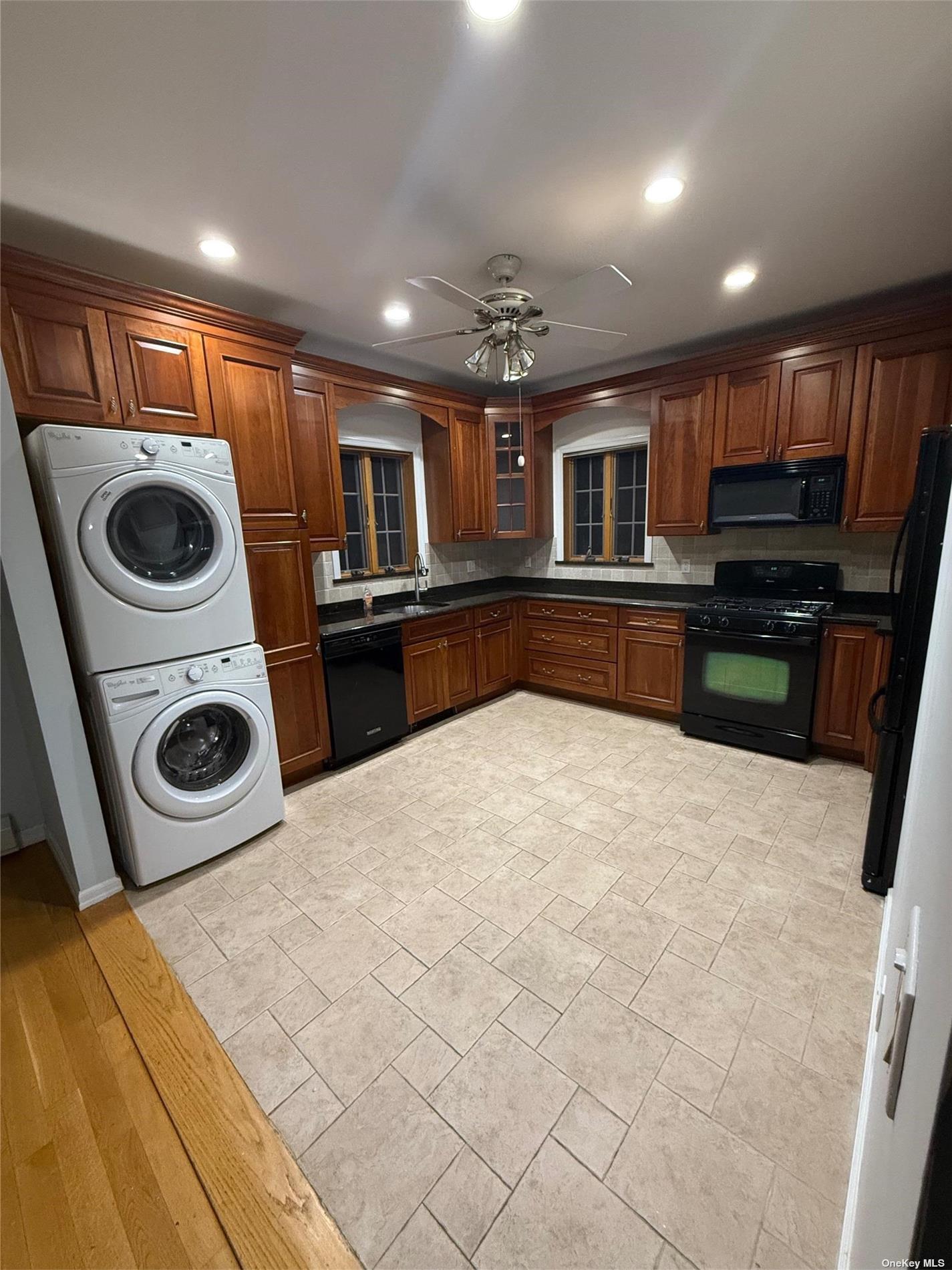 a kitchen with a stove a microwave and refrigerator