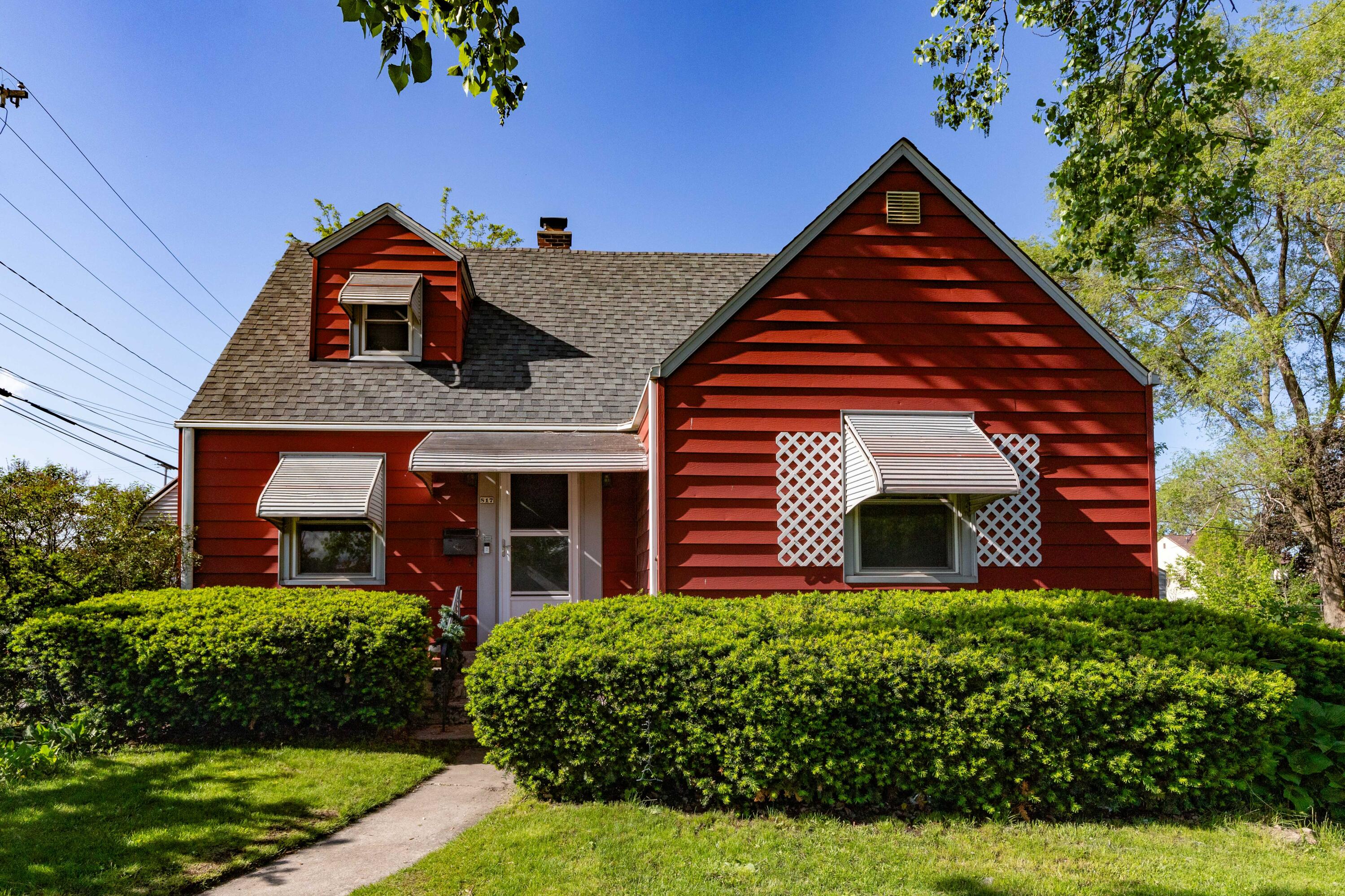 front view of a house with a yard