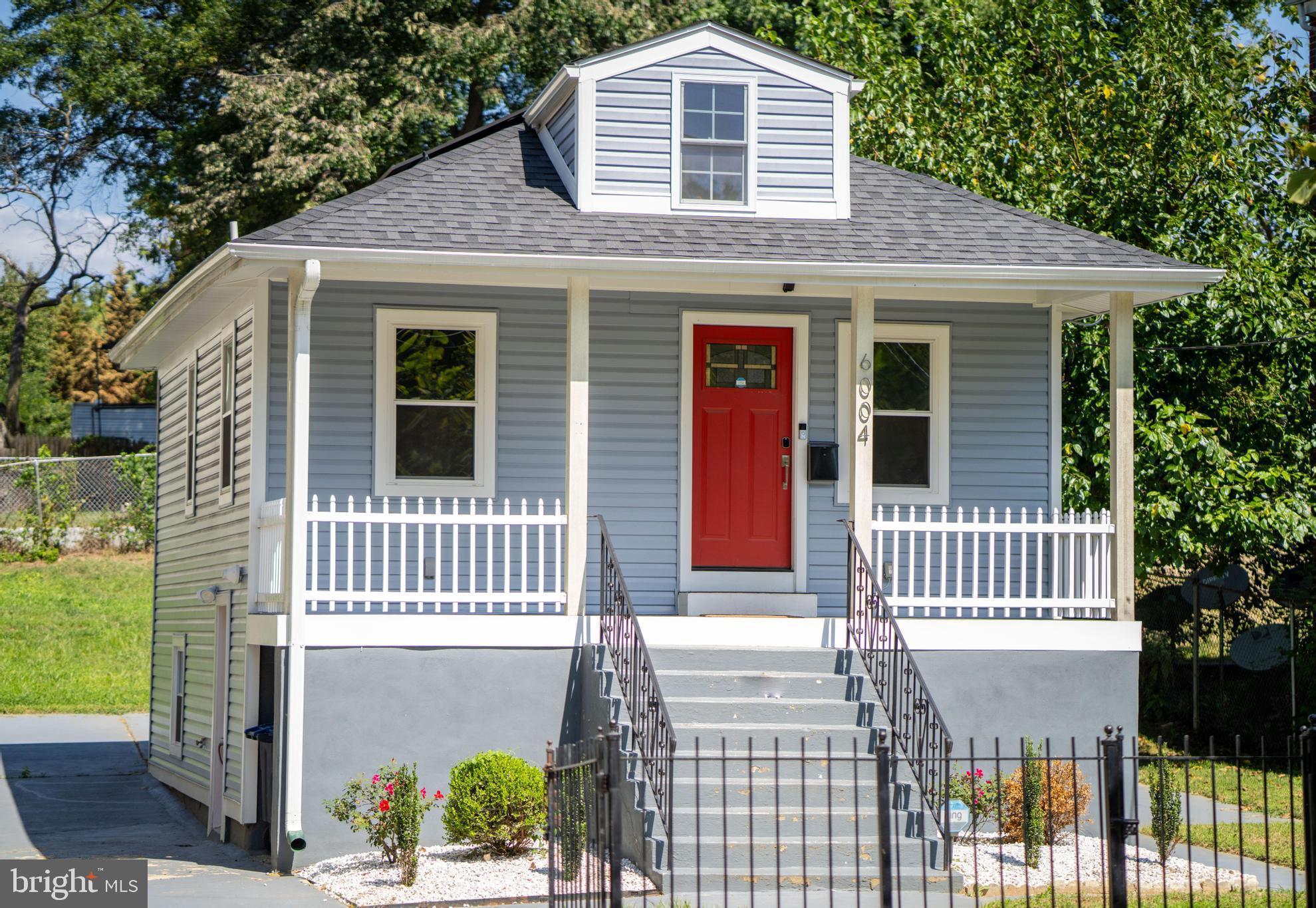 a front view of a house with a porch