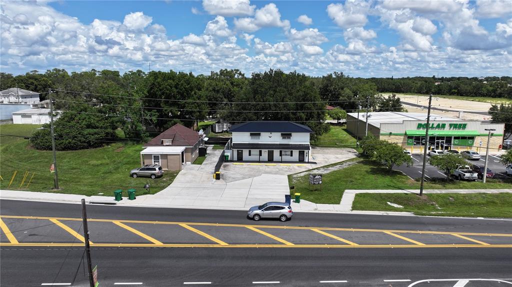 an aerial view of a house with a yard