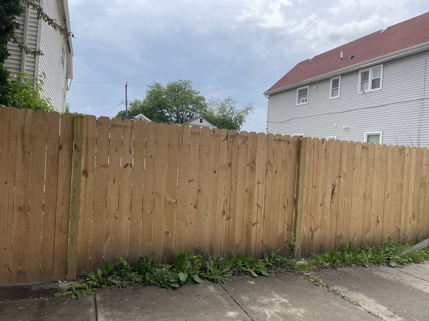 a wooden door with a wooden fence