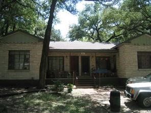 a front view of a house with yard