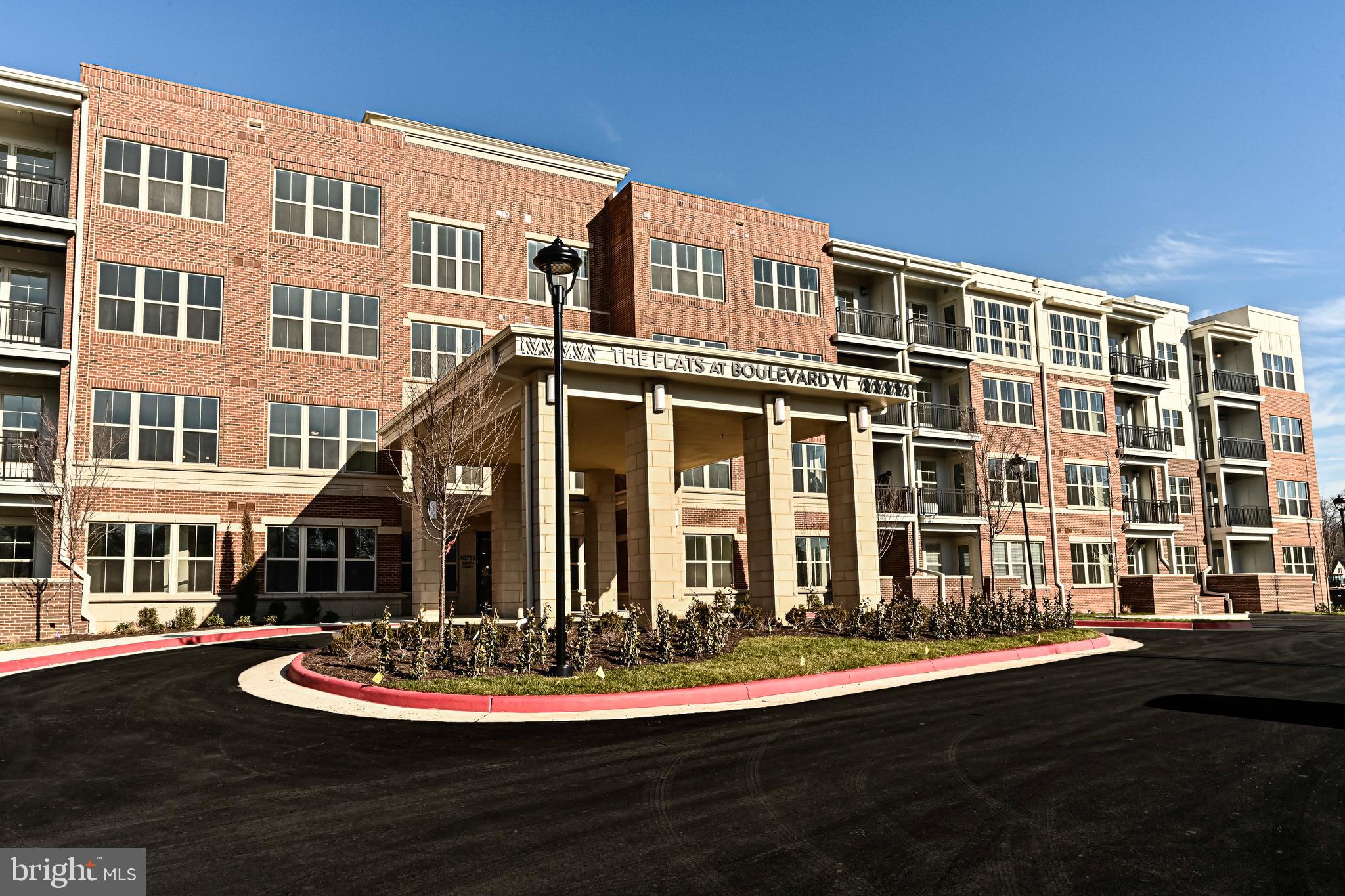 a front view of a building with a lot of windows