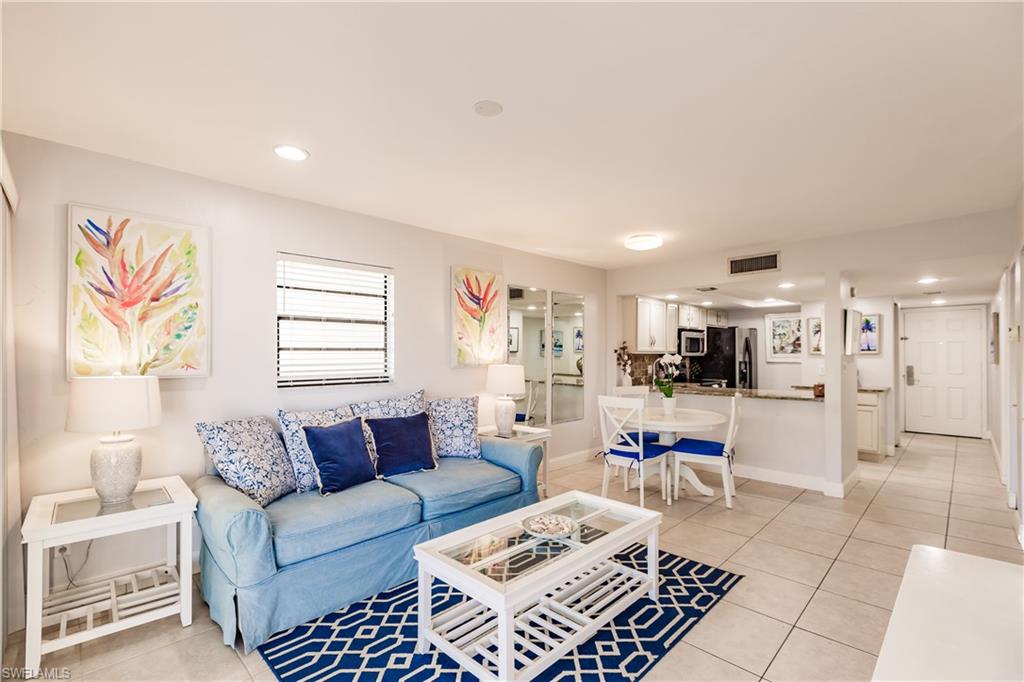 a living room with furniture and a table