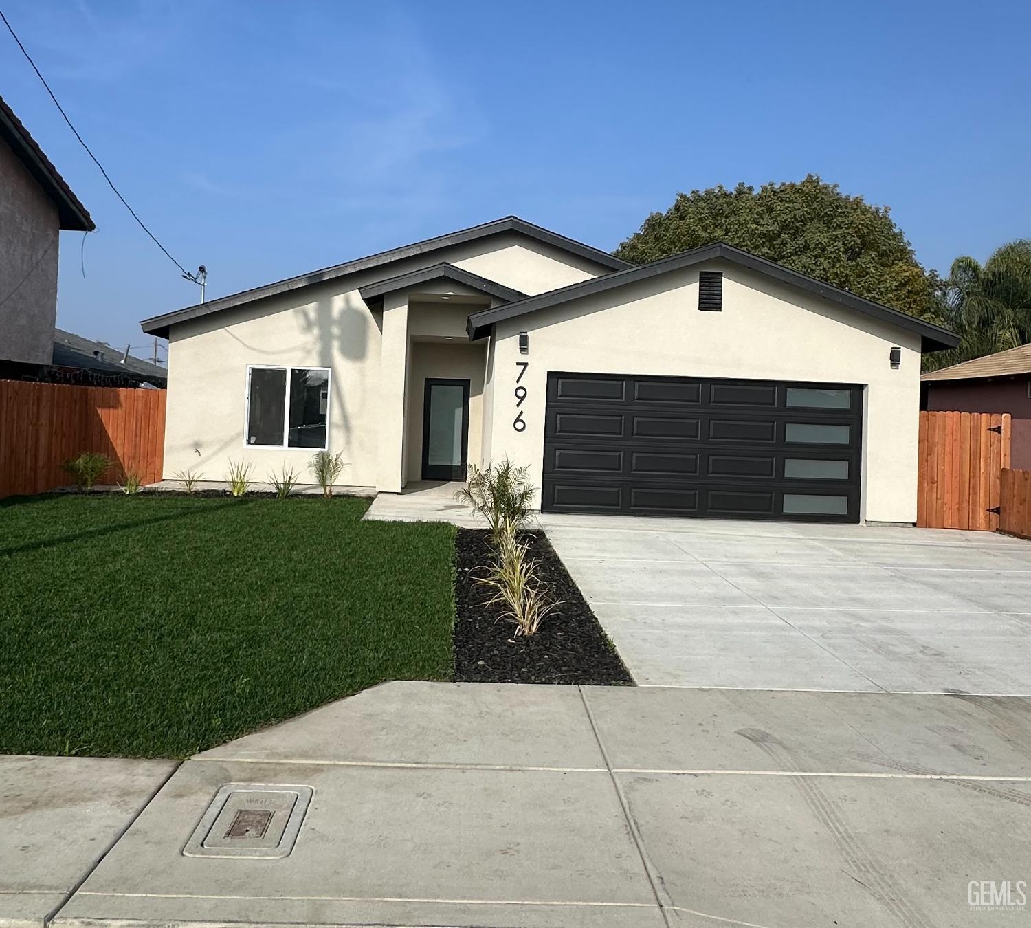 a front view of a house with yard