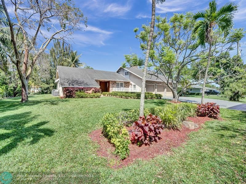 a view of a house with a garden