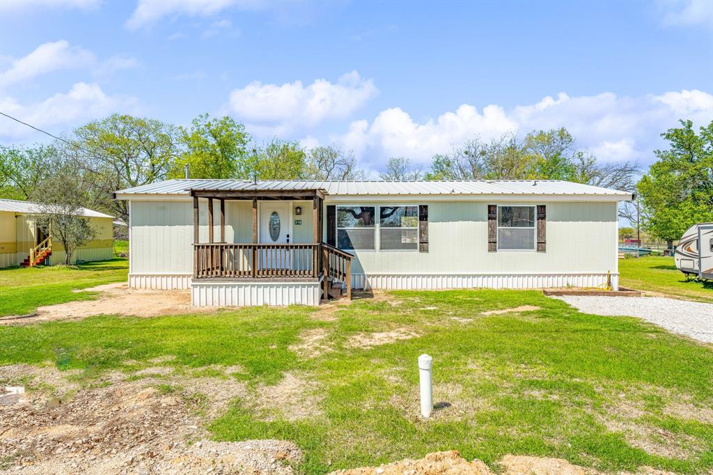 a view of a house with a yard patio and a patio