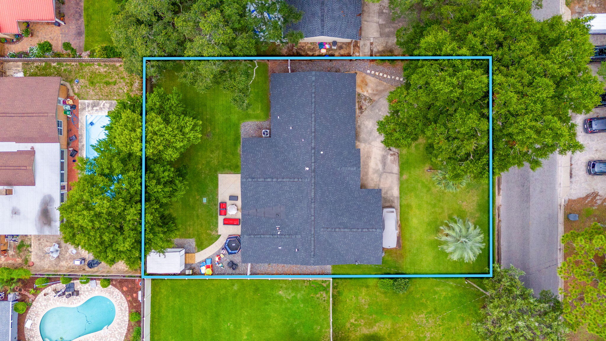 an aerial view of a house with a yard