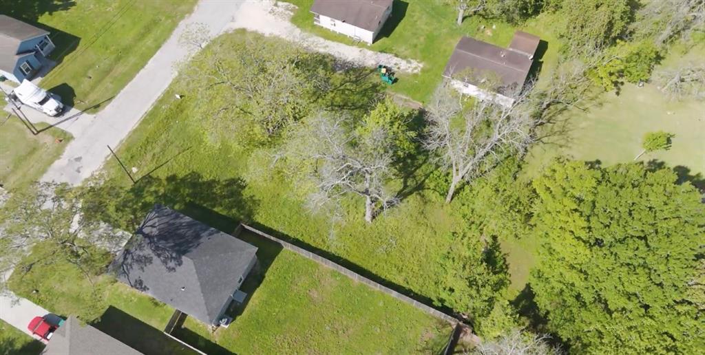 an aerial view of a residential houses with outdoor space