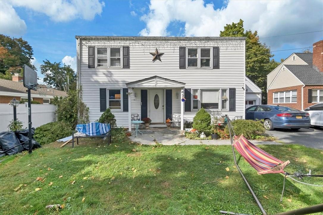 View of front of property with a front lawn