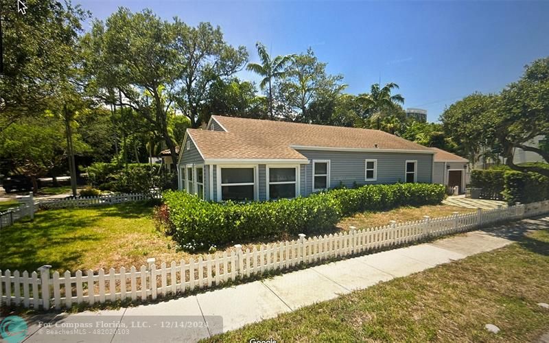 a aerial view of a house with a yard