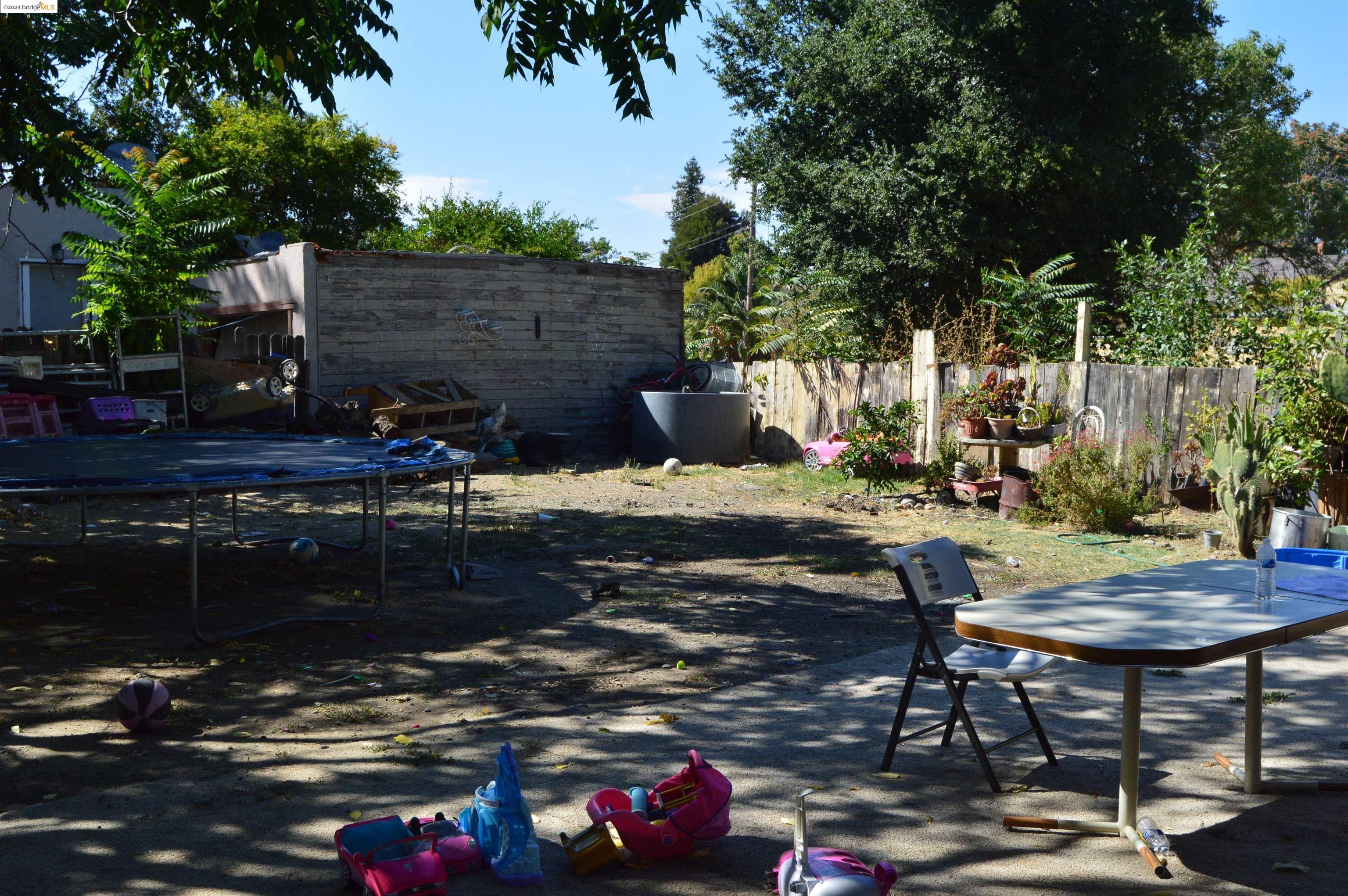 a view of backyard with seating space