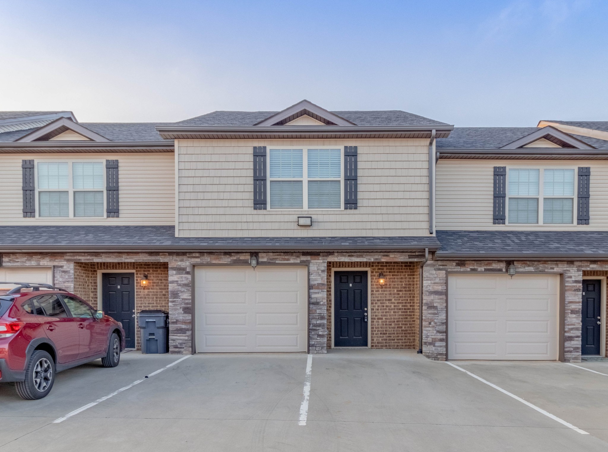 a front view of a house with a garage