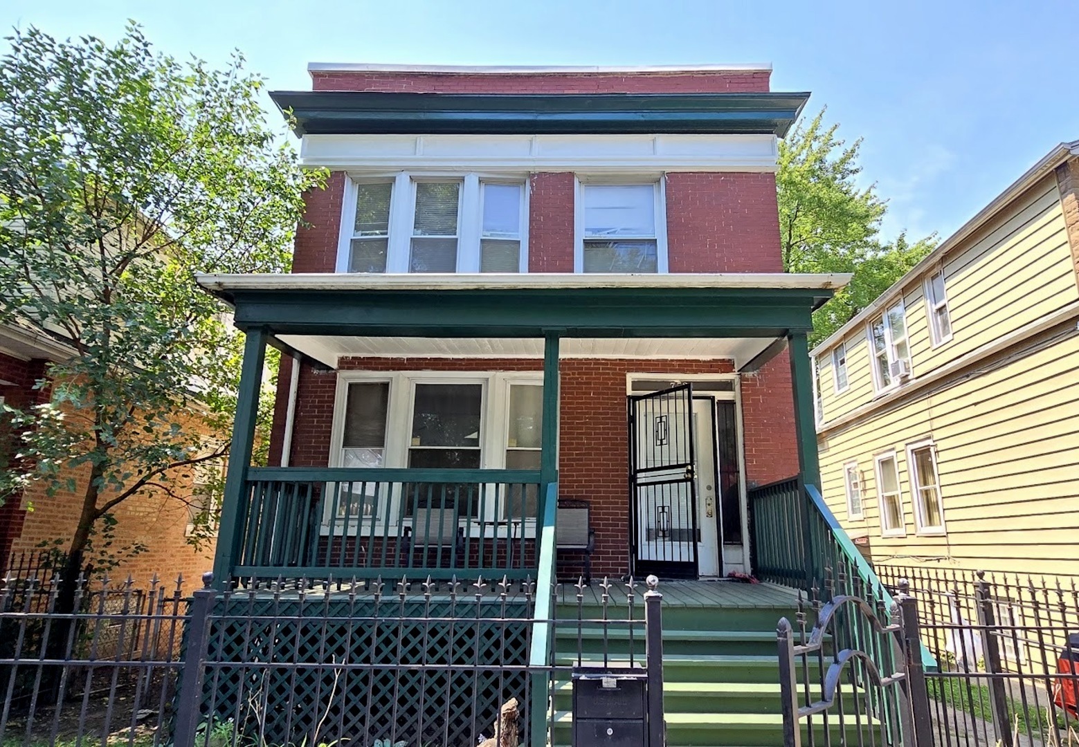 front view of a house with a red door