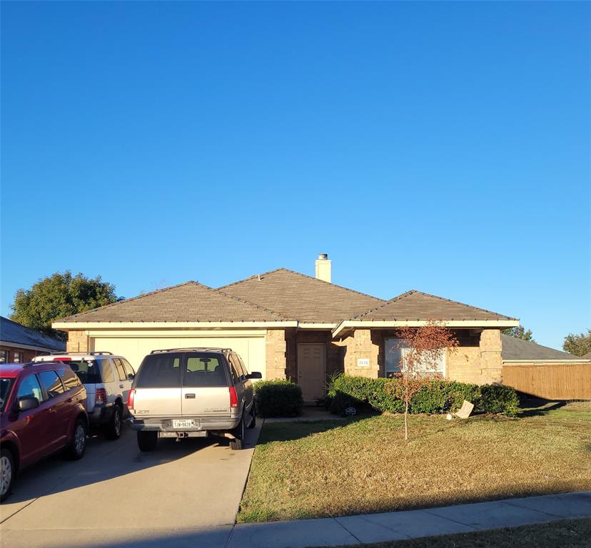 a view of a car parked in front of a house