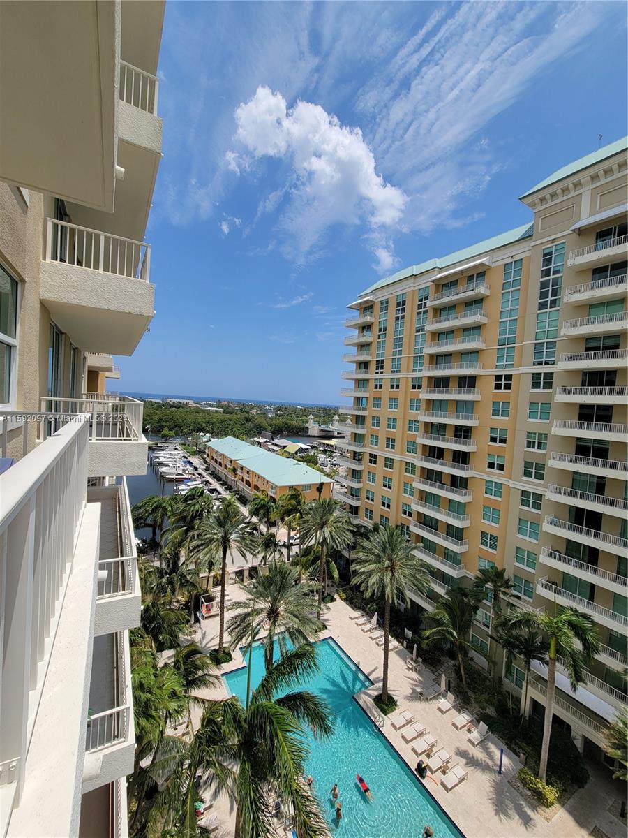 a view of a balcony with sitting area