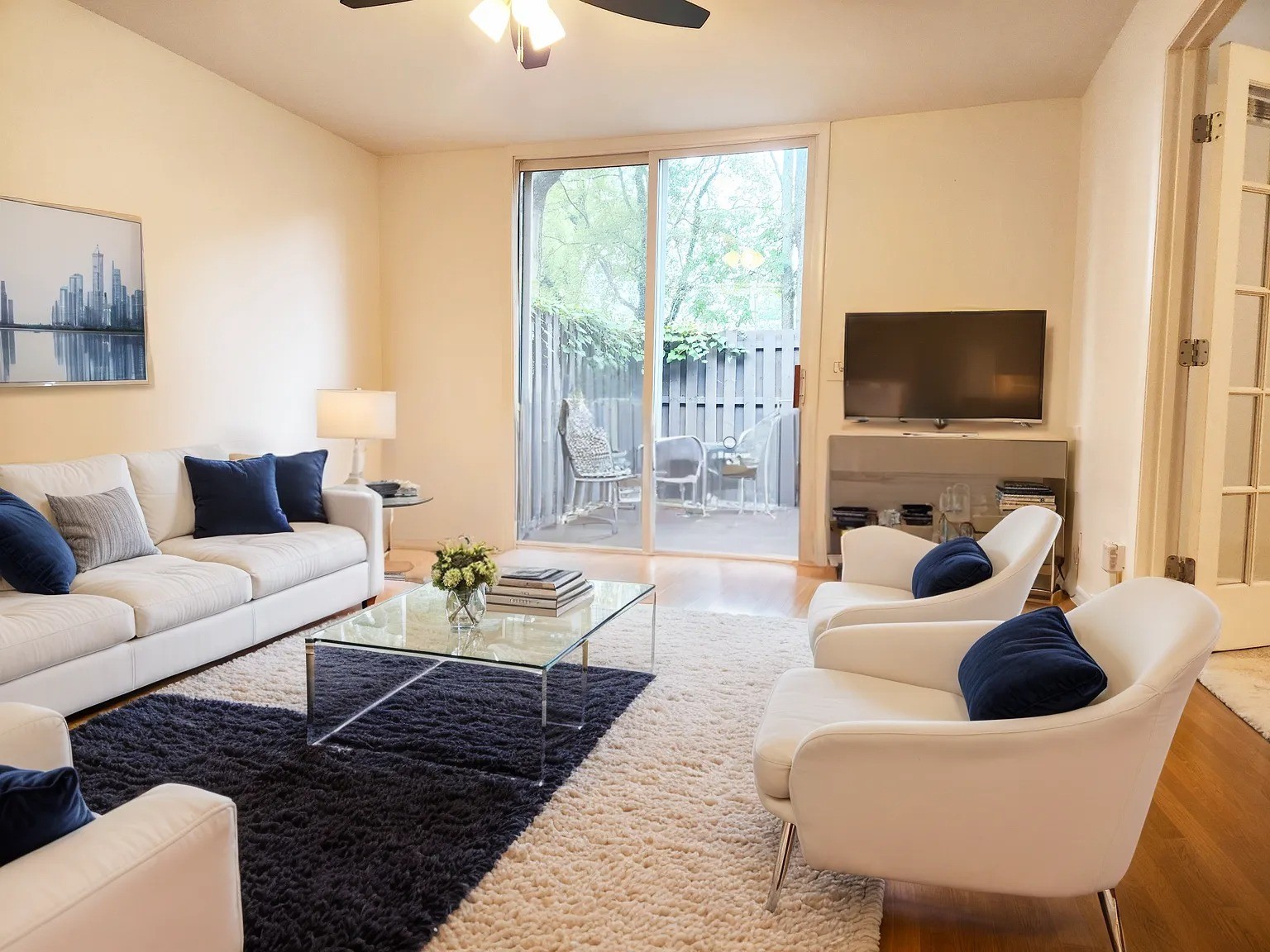 a living room with furniture and a flat screen tv