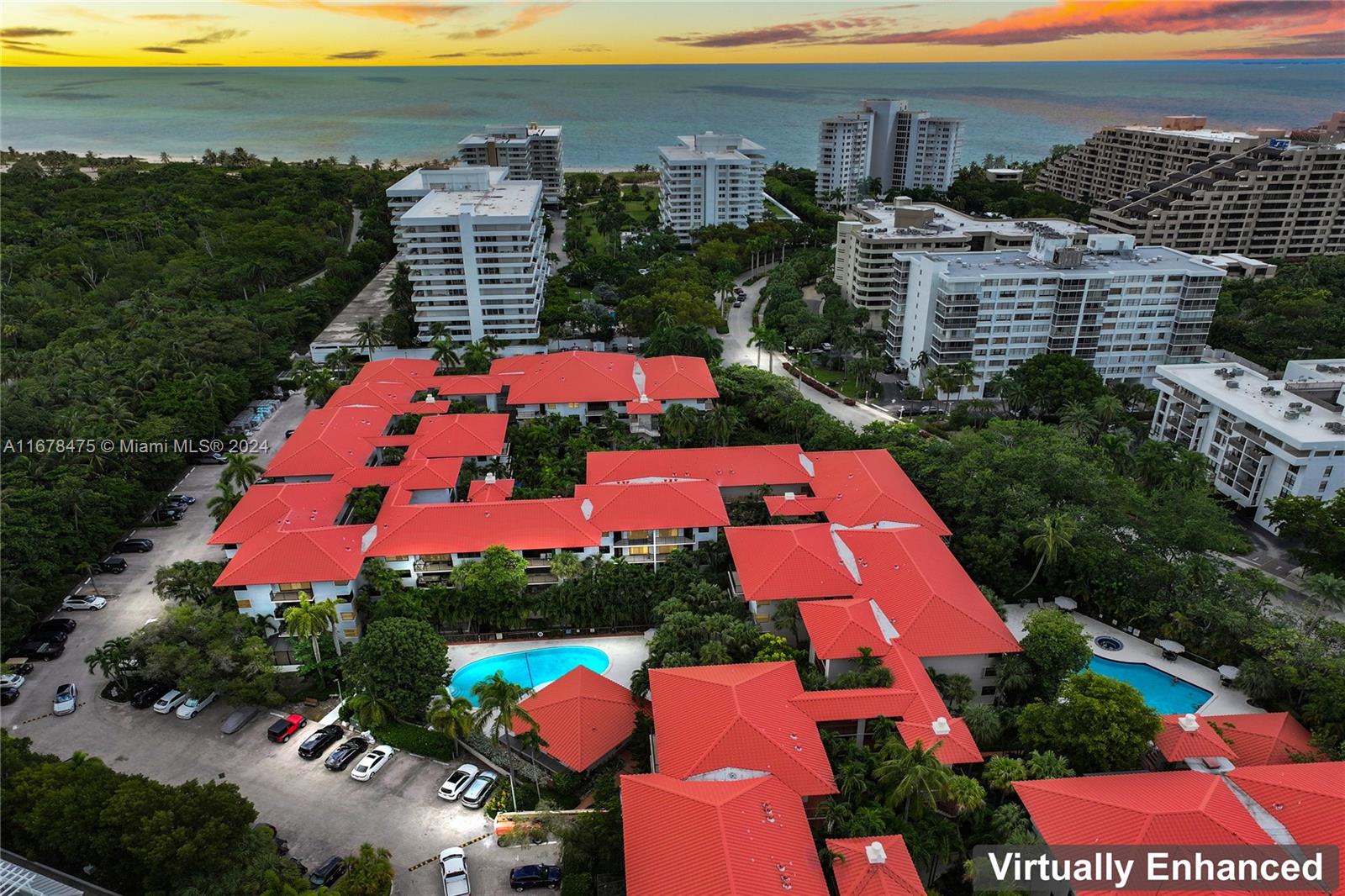 an aerial view of multiple houses with yard