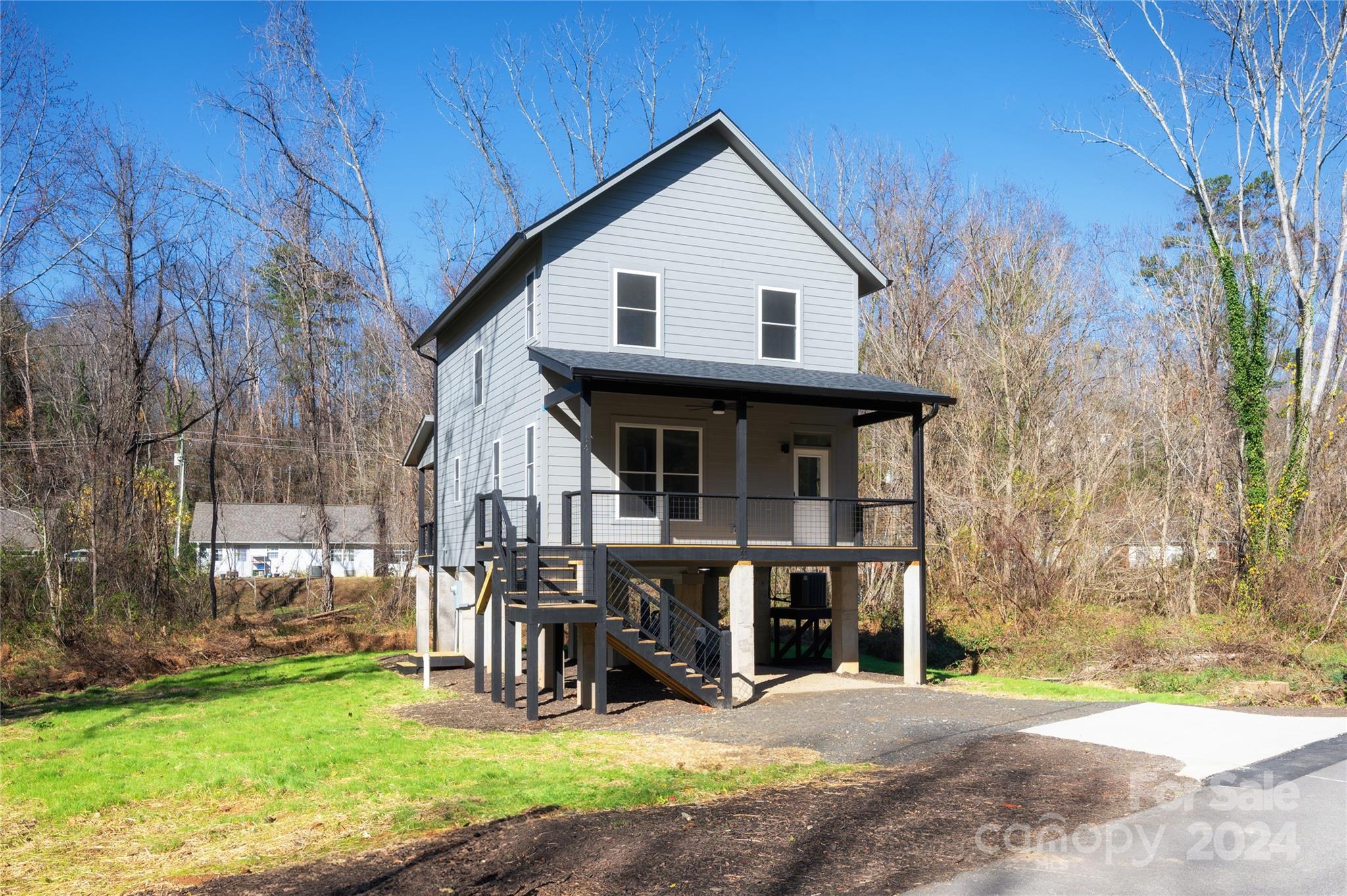 a view of a house with backyard porch and sitting area