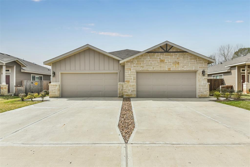 a front view of a house with garage