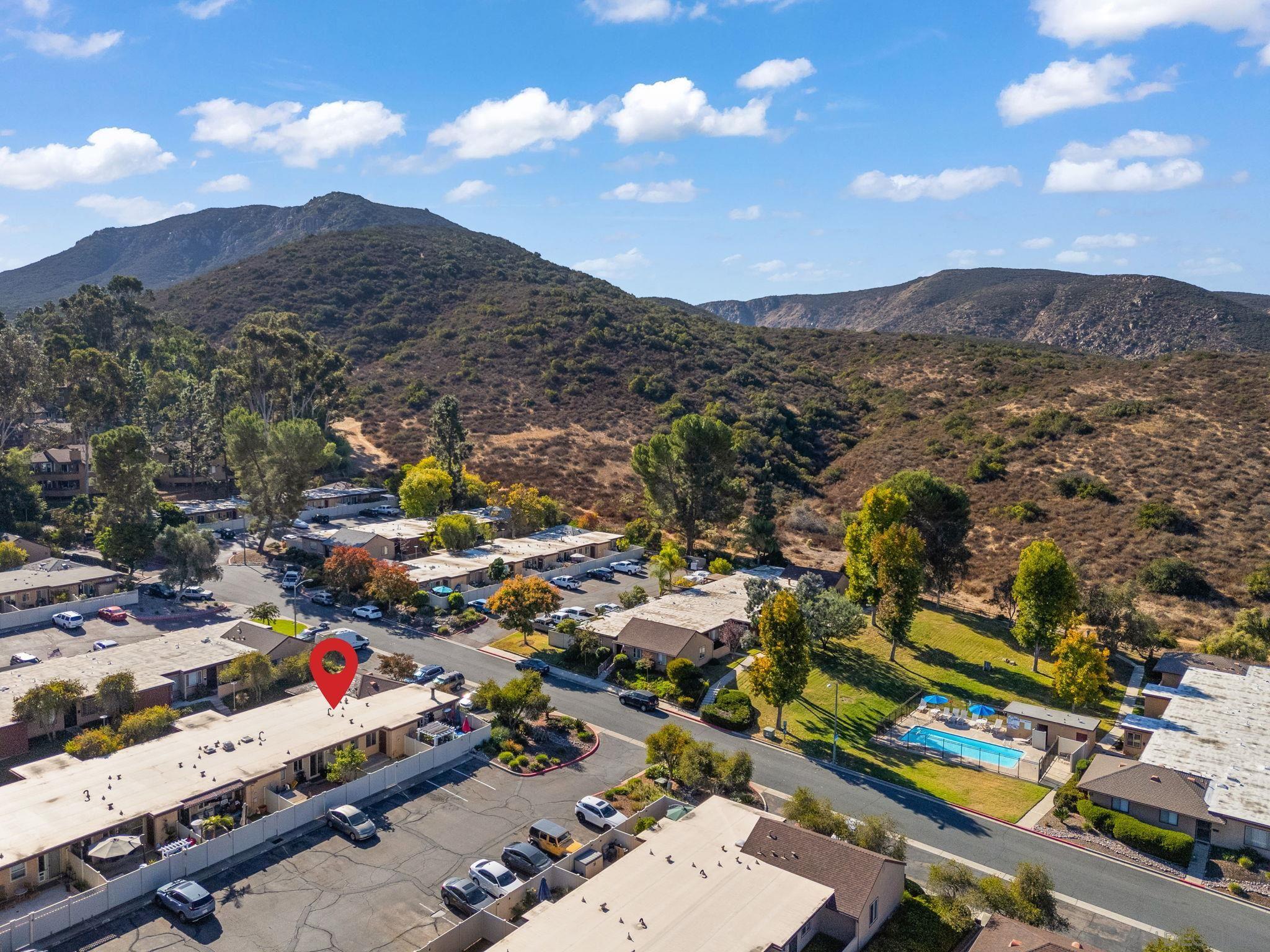 an aerial view of residential houses with outdoor space