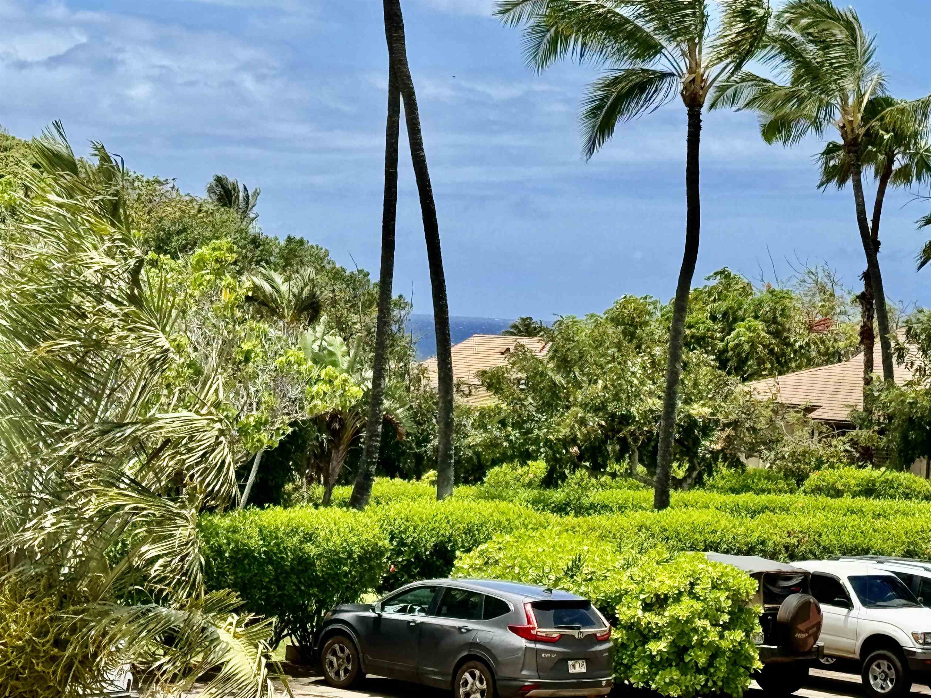 a view of a car parked on the side of a road