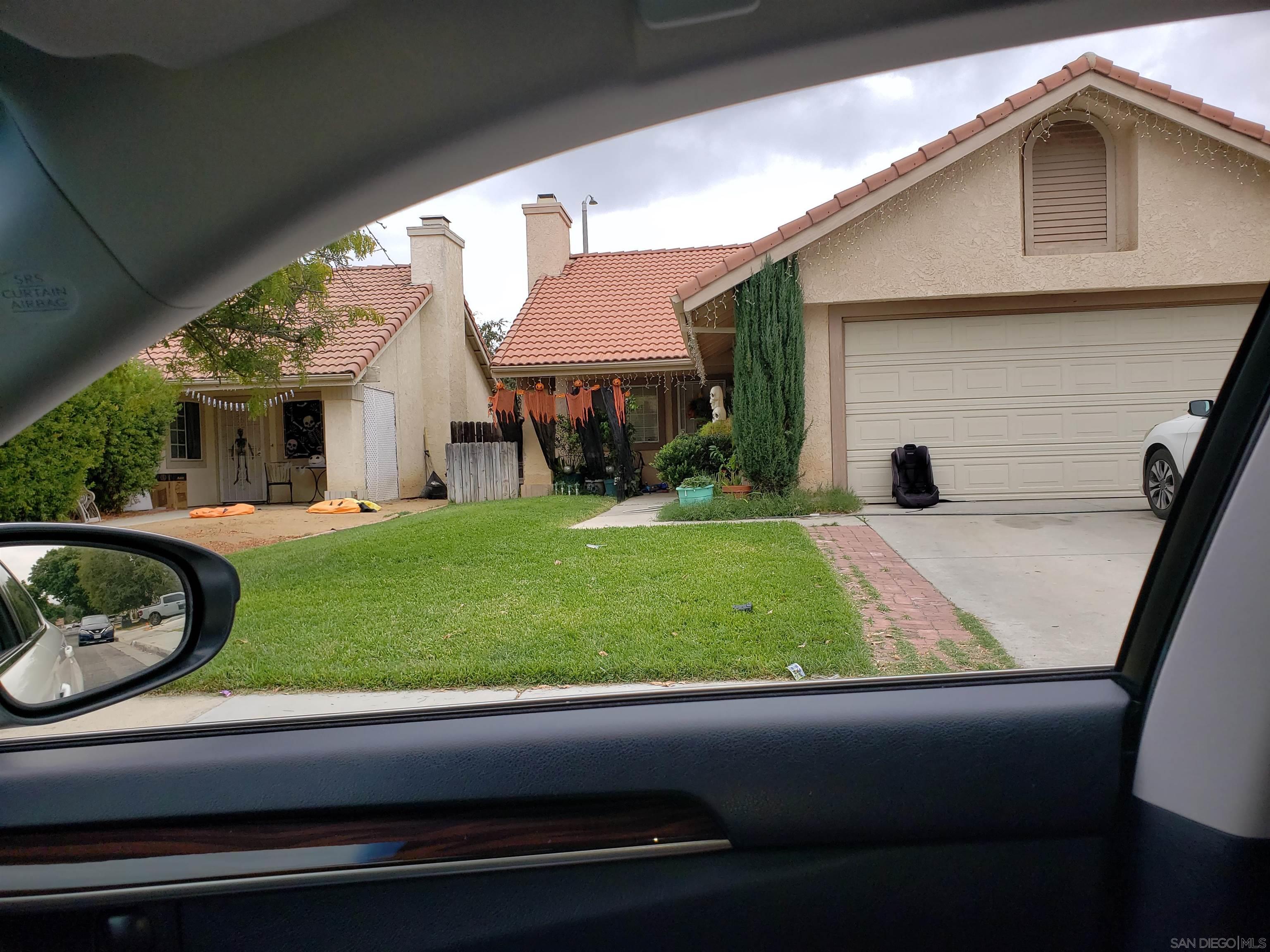 a view of a house with a back yard