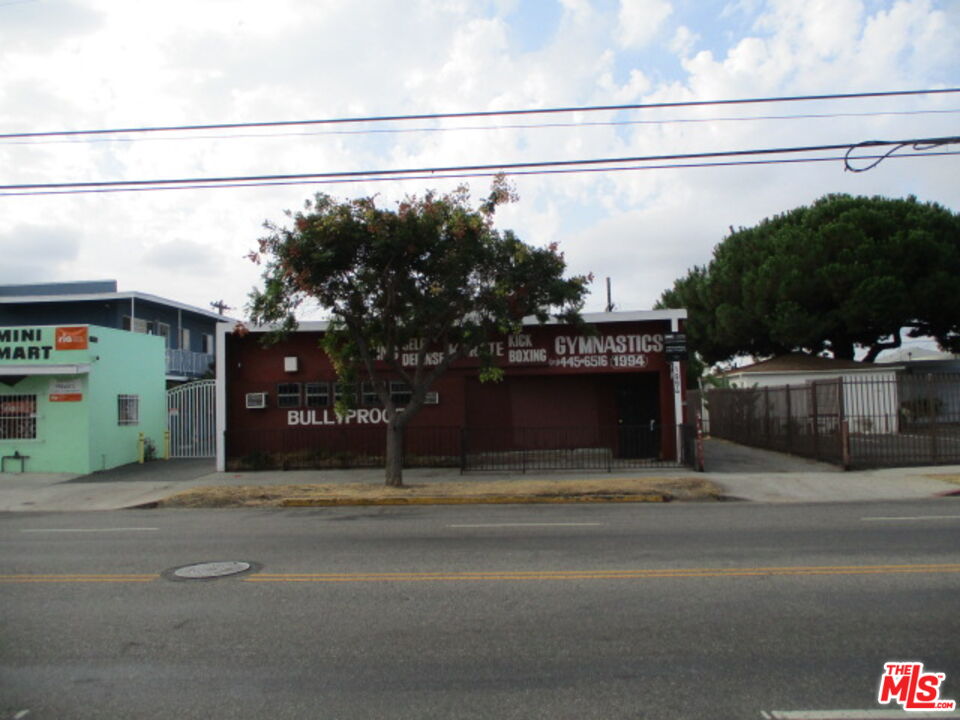 a view of a street with a building in the background