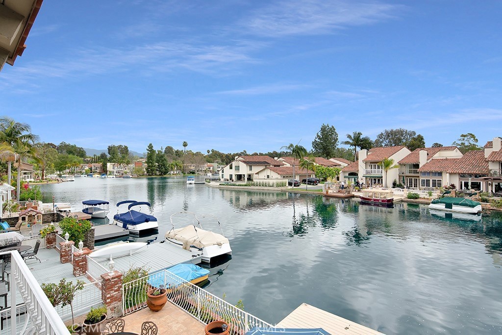 a lake view with boat and palm trees