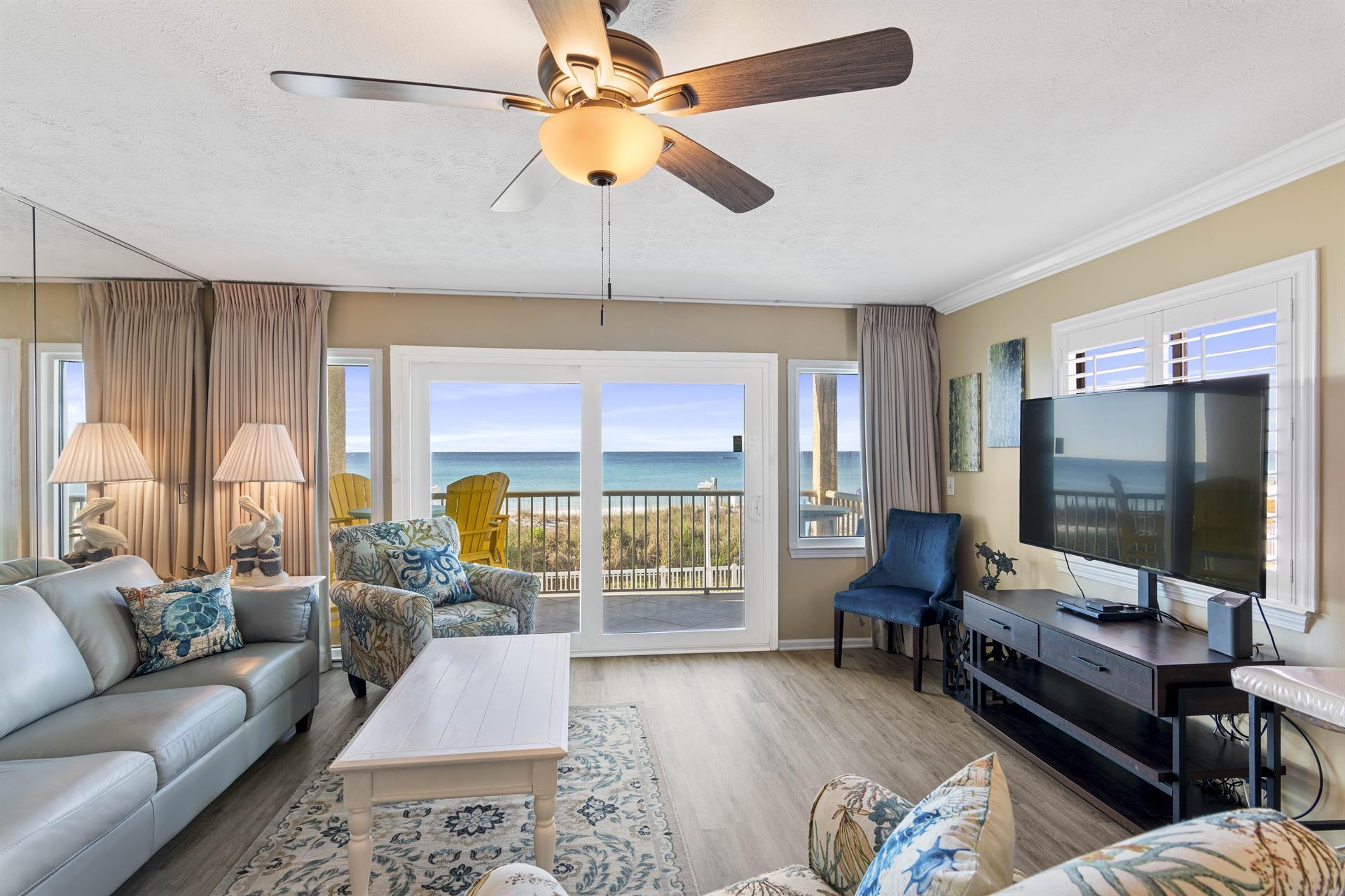 a living room with furniture and a flat screen tv