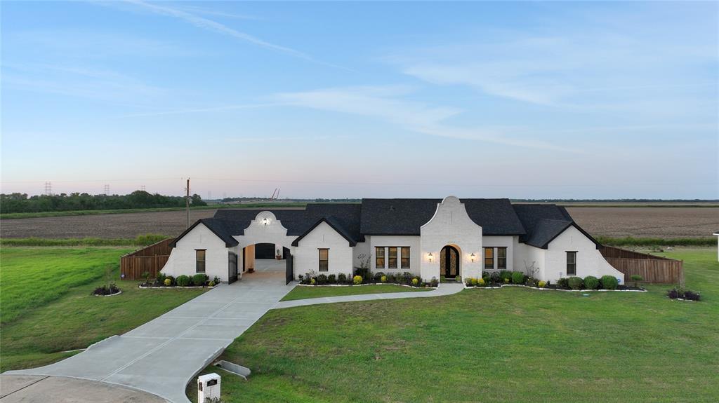 a front view of house with yard and seating area