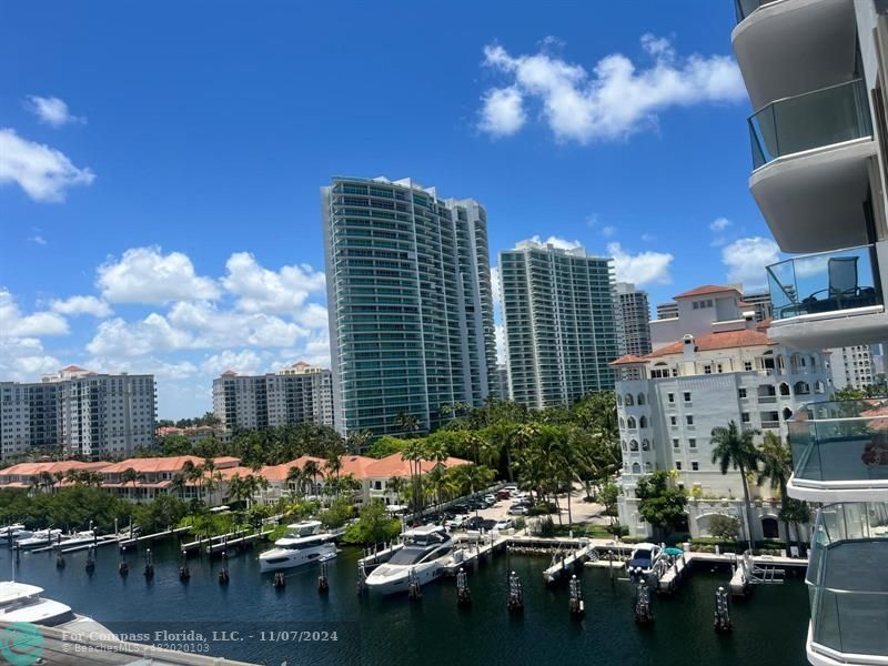 a view of a lake with tall buildings