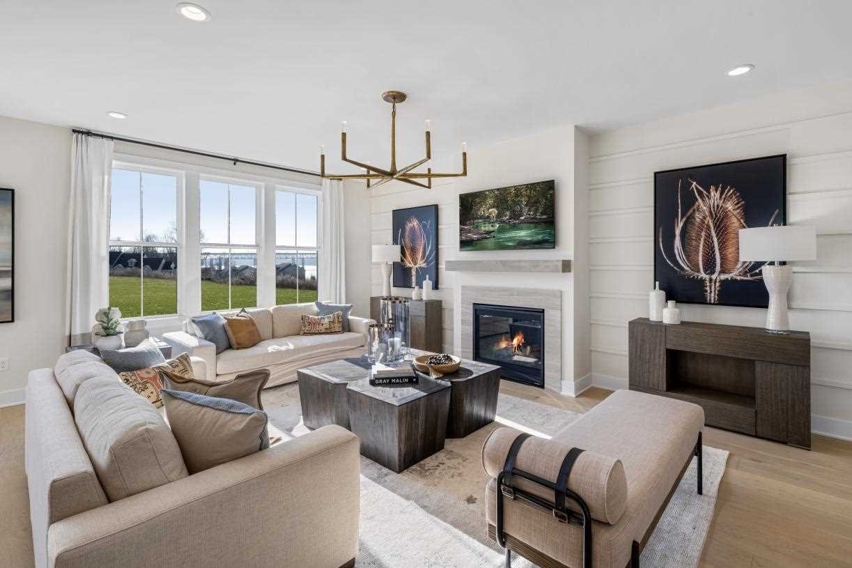 a living room with furniture fireplace and flat screen tv