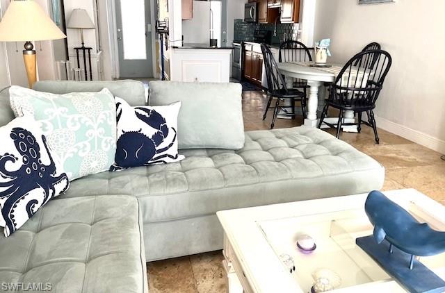 a living room with furniture and a table