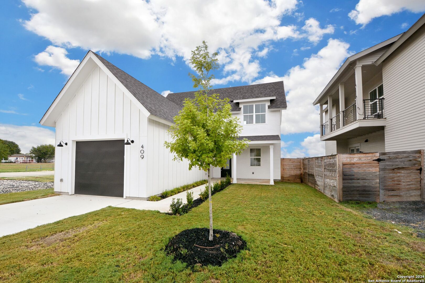 a house view with a garden space