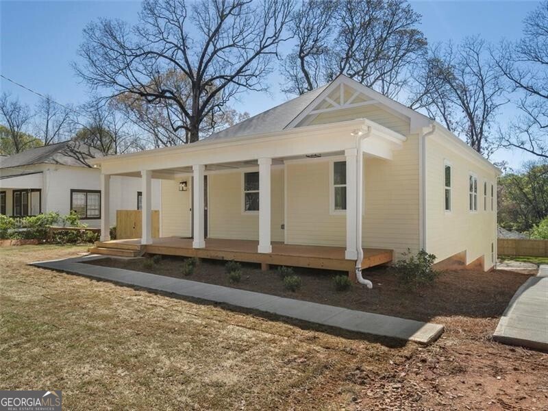 a front view of a house with yard