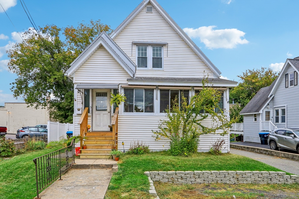 front view of a house with a yard