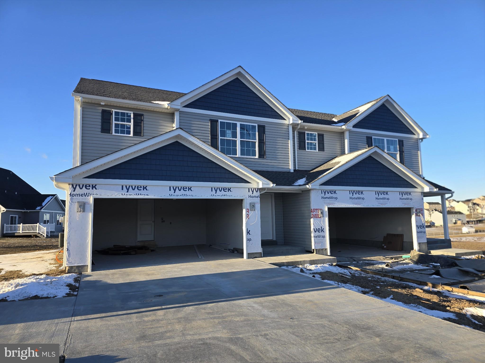 a front view of a house with yard