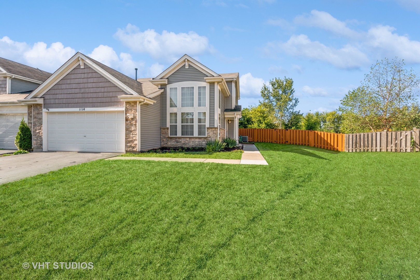 a front view of a house with a yard