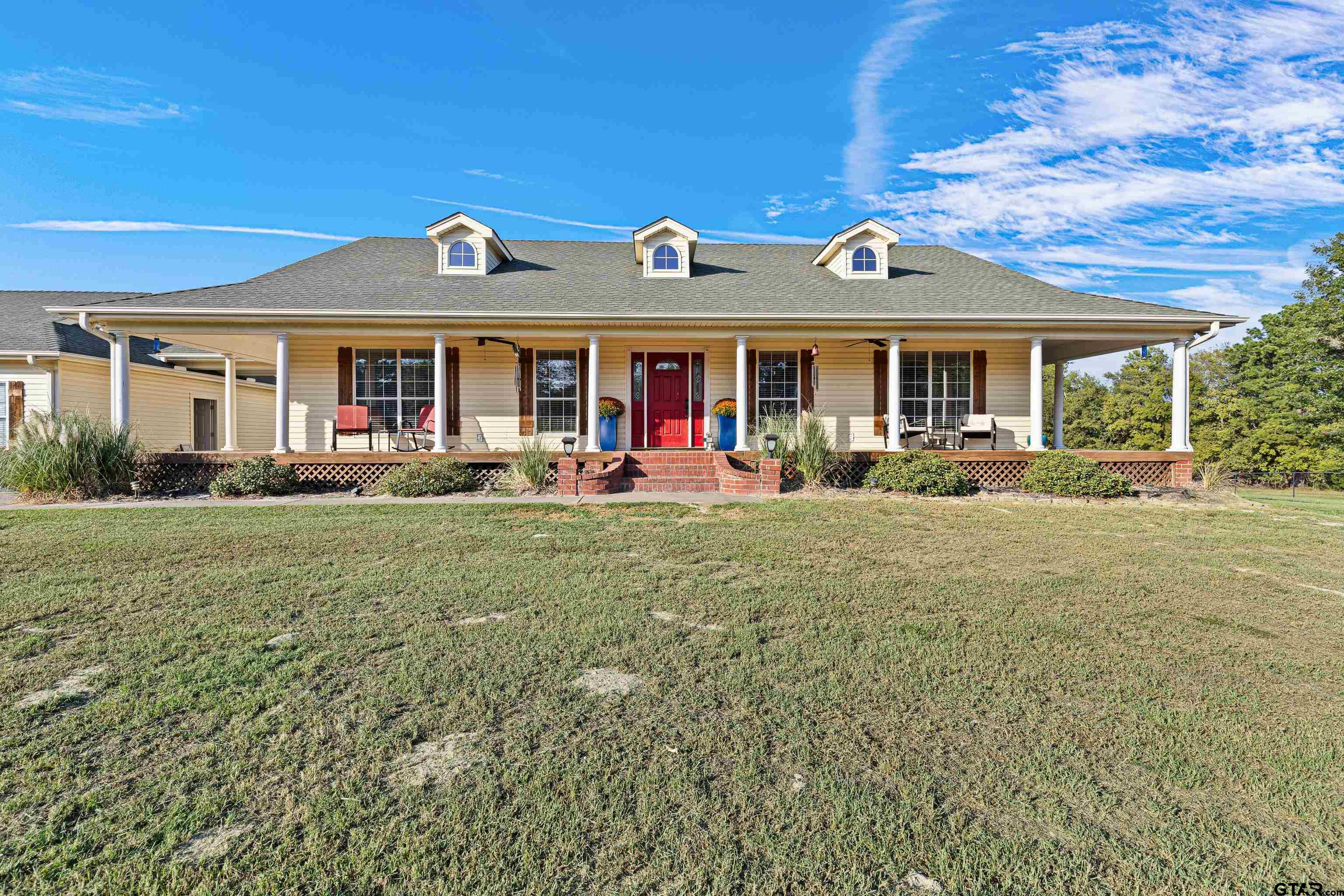 a front view of a house with an outdoor space