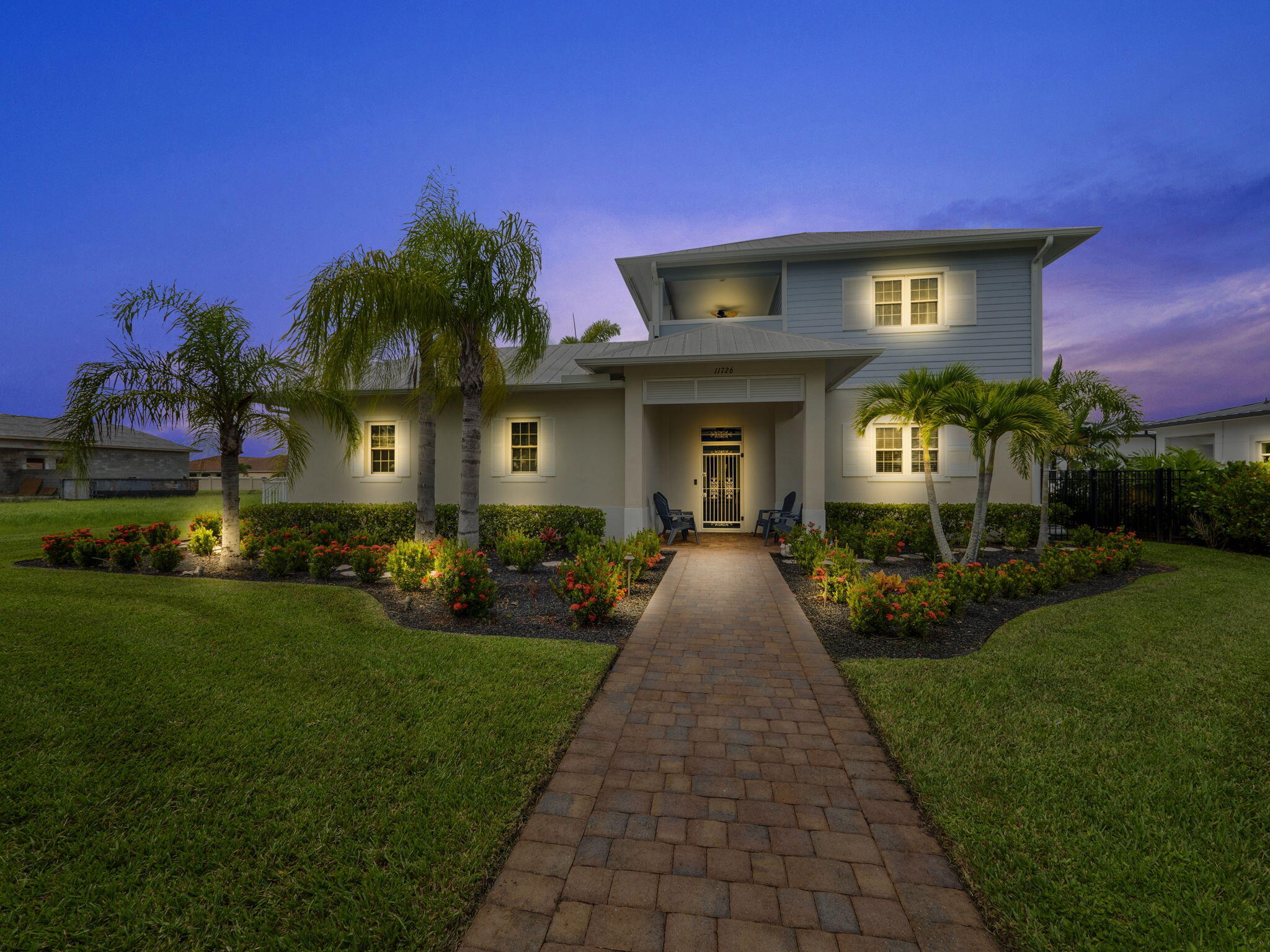 a front view of a house with a yard