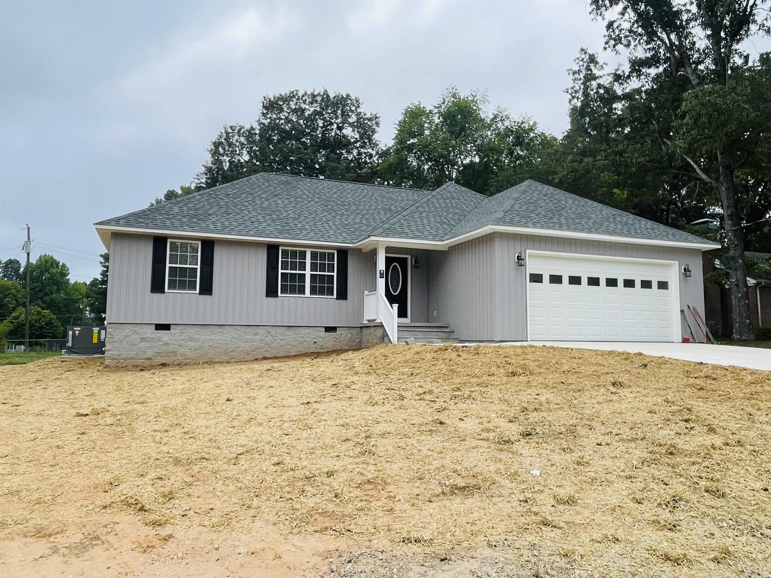 View of front facade featuring a garage