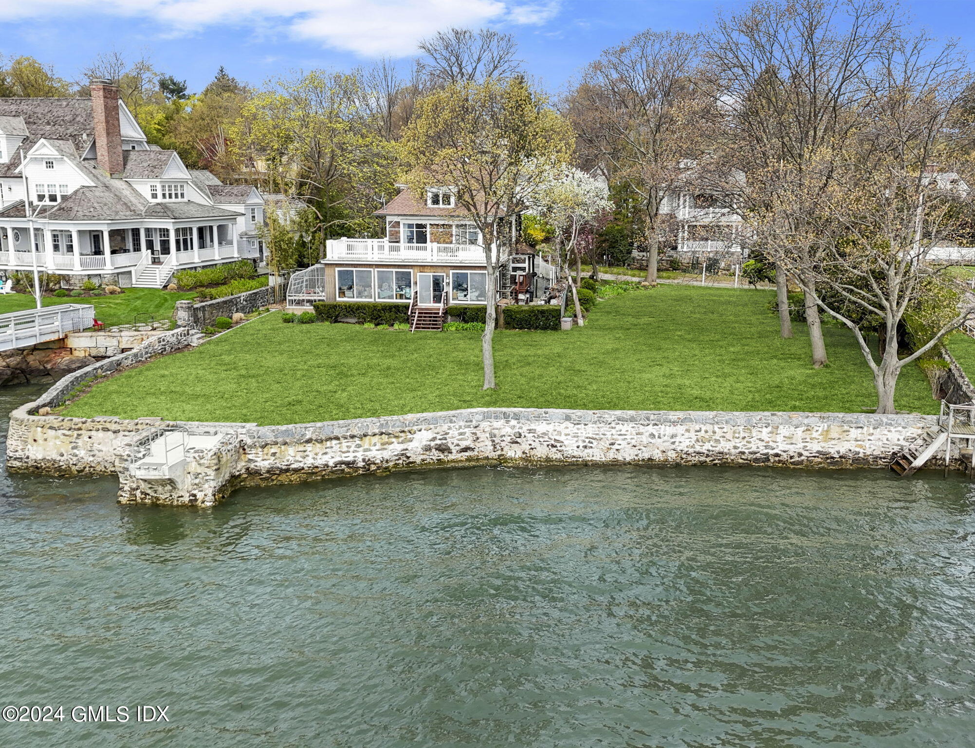 a view of a house with a yard and a large pool