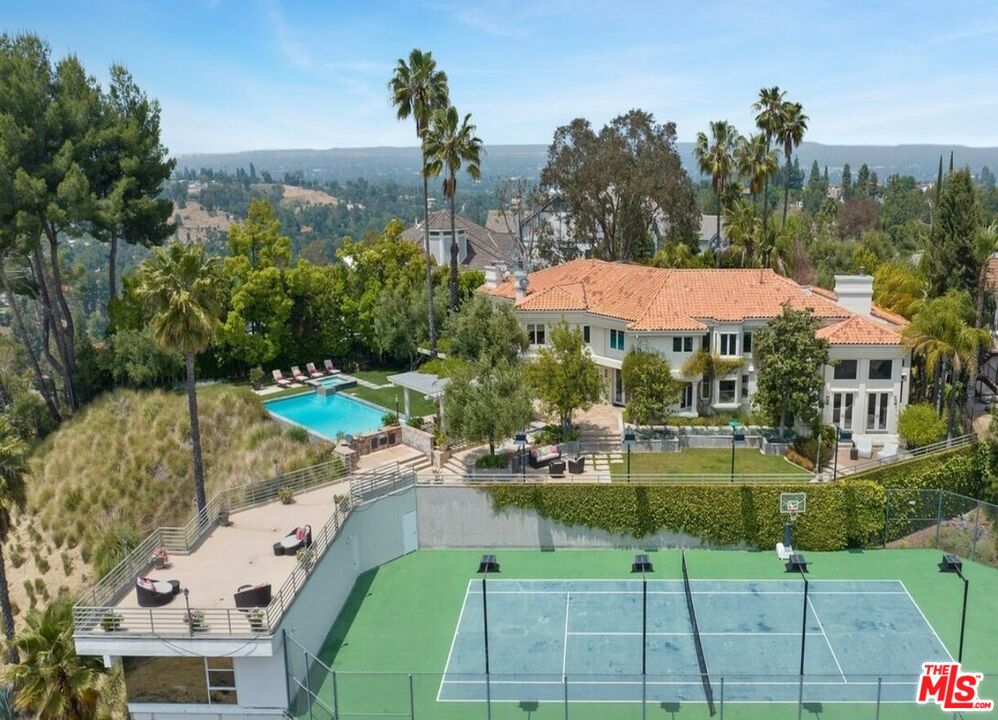 a view of a swimming pool with a patio