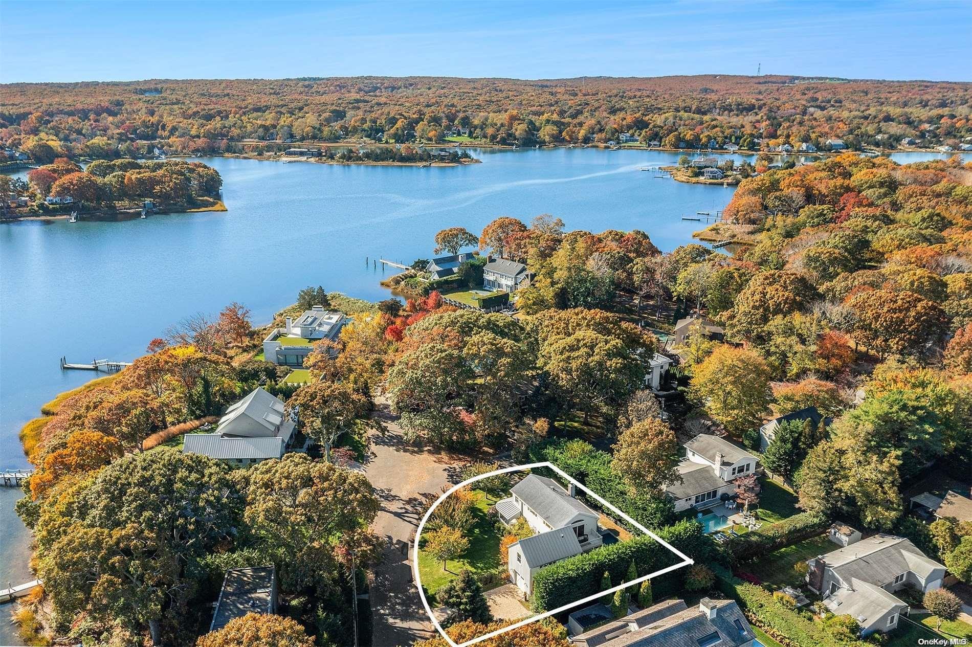 an aerial view of a house with a lake view