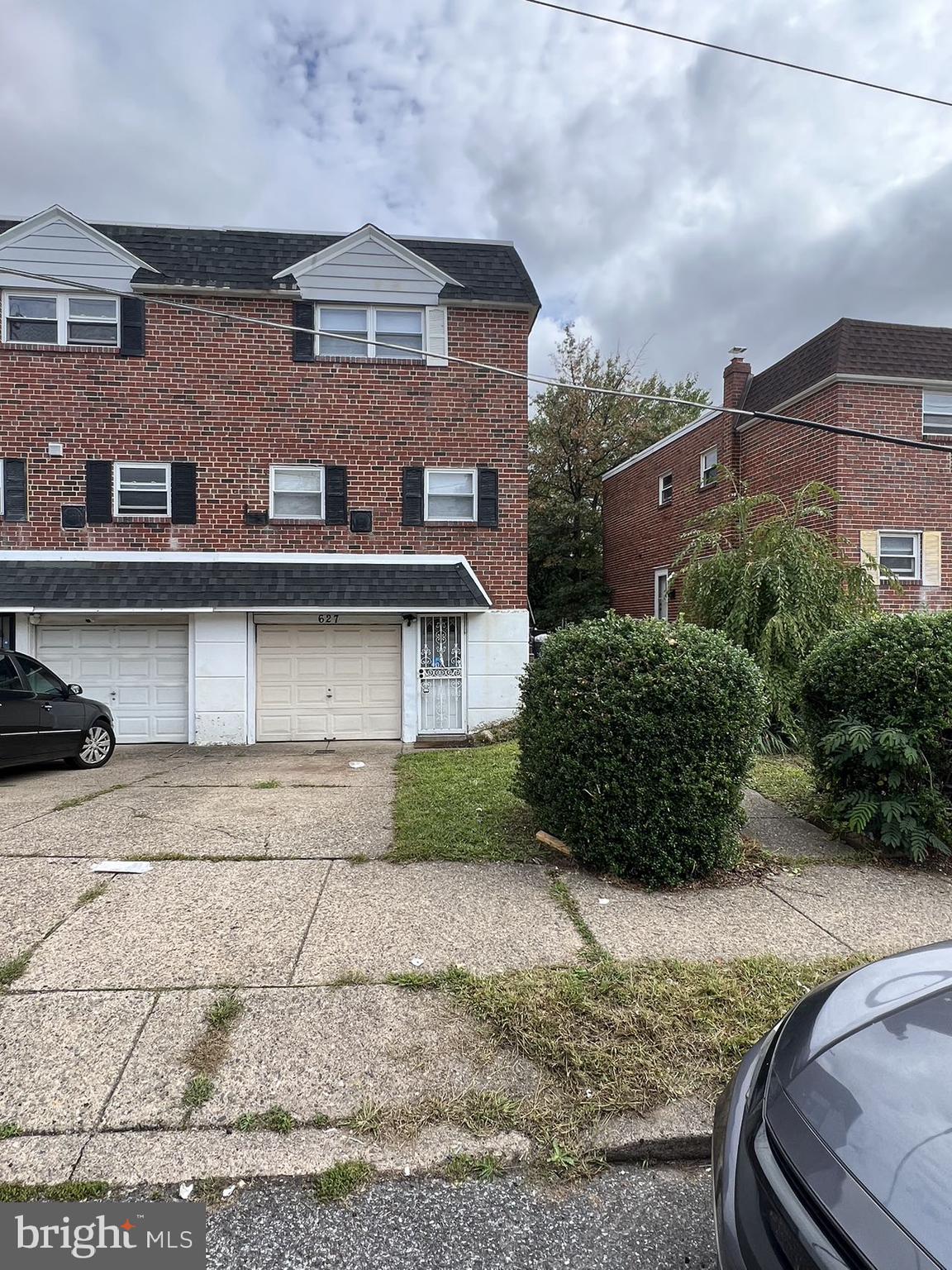 a view of a building with a yard