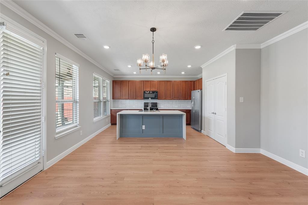 a view of a kitchen with a sink and a window